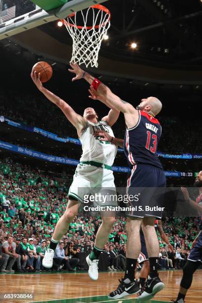 Kelly Olynyk of the Boston Celtics goes up for a shot against the Washington Wizards during Game Seven of the Eastern Conference Semifinals of the...