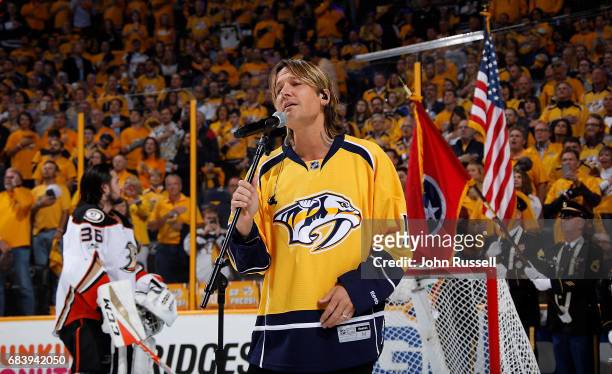 Country music artist Keith Urban sings the National Anthem prior to Game Three of the Western Conference Final between the Nashville Predators and...