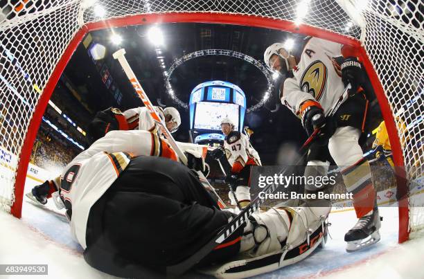 John Gibson of the Anaheim Ducks lies on the ice as he attempts to make a save during the first period against the Nashville Predators in Game Three...