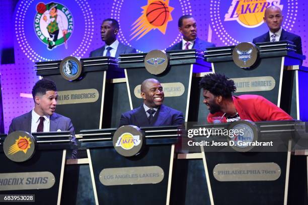 Devin Booker#1 of the Phoeix Suns, Magic Johnson of the Los Angeles Lakers and Joel Embiid of the Philadelphia 76ers laugh during the 2017 NBA Draft...