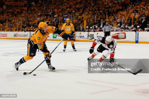 Ryan Johansen of the Nashville Predators skates with the puck against Jakob Silfverberg of the Anaheim Ducks during the first period in Game Three of...