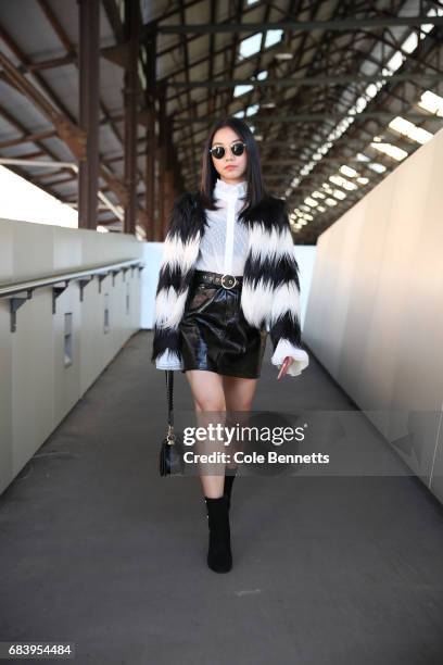 Alvina Tan wearing a Front Row jacket, Glasson skirt and Chanel bag during Mercedes-Benz Fashion Week Resort 18 Collections at Carriageworks on May...