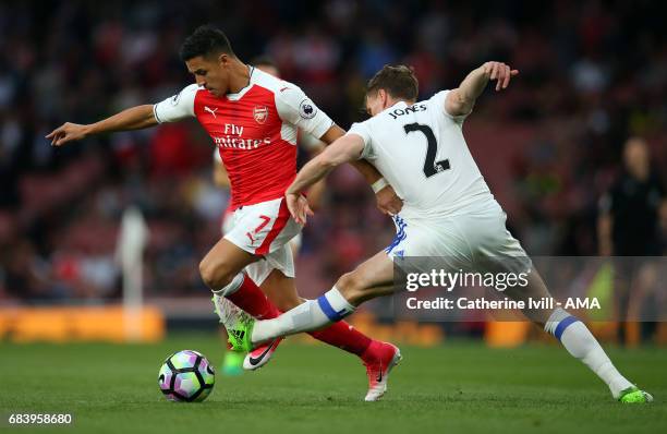 Alexis Sanchez of Arsenal and Billy Jones of Sunderland during the Premier League match between Arsenal and Sunderland at Emirates Stadium on May 16,...