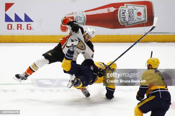 Jared Boll of the Anaheim Ducks hits Harry Zolnierczyk of the Nashville Predators during the second period in Game Three of the Western Conference...