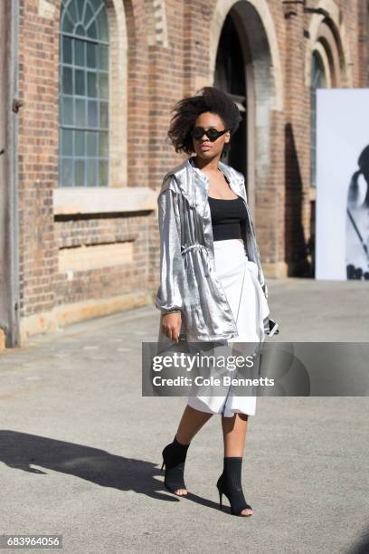 Aicha Robertson wearing Misguided jacket, Tony Maticevski skirt, Celibe Sunglasses and Skagen handbag during Mercedes-Benz Fashion Week Resort 18...