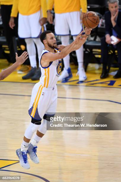 Stephen Curry of the Golden State Warriors attempts a last second shot at the end of the first half against the San Antonio Spurs during Game Two of...