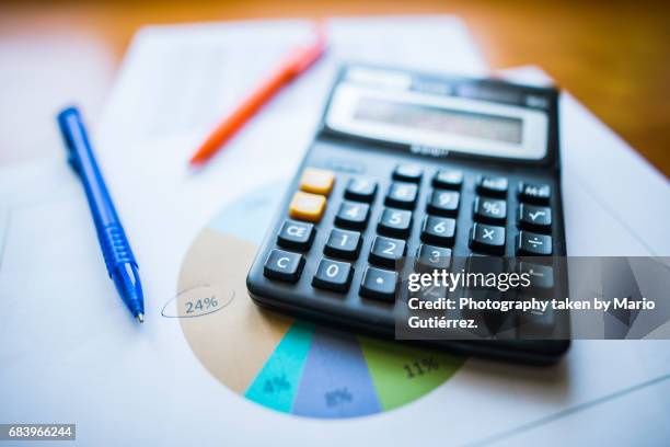 calculator and paper sheets with data - financial analyst stock pictures, royalty-free photos & images