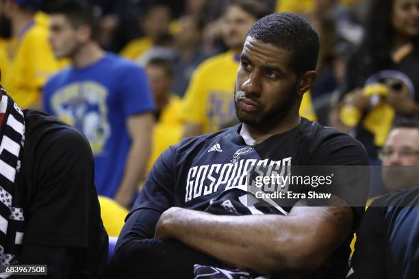 LaMarcus Aldridge of the San Antonio Spurs sits on the bench in the final minutes of their 136-100 loss to the Golden State Warriors in Game Two of...