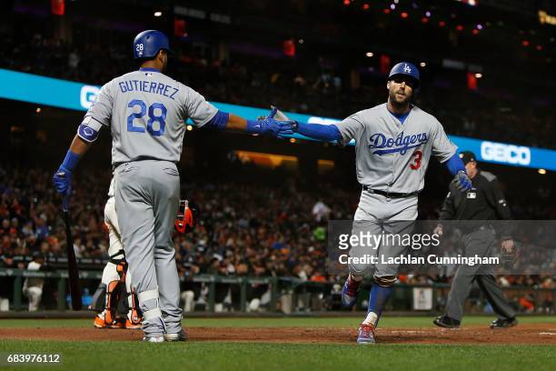 Chris Taylor of the Los Angeles Dodgers celebrates with Franklin Gutierrez of the Los Angeles Dodgers after hitting a solo home run in the sixth...