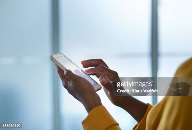 close-up of businesswomans hands holding phone - look back ストックフォトと画像
