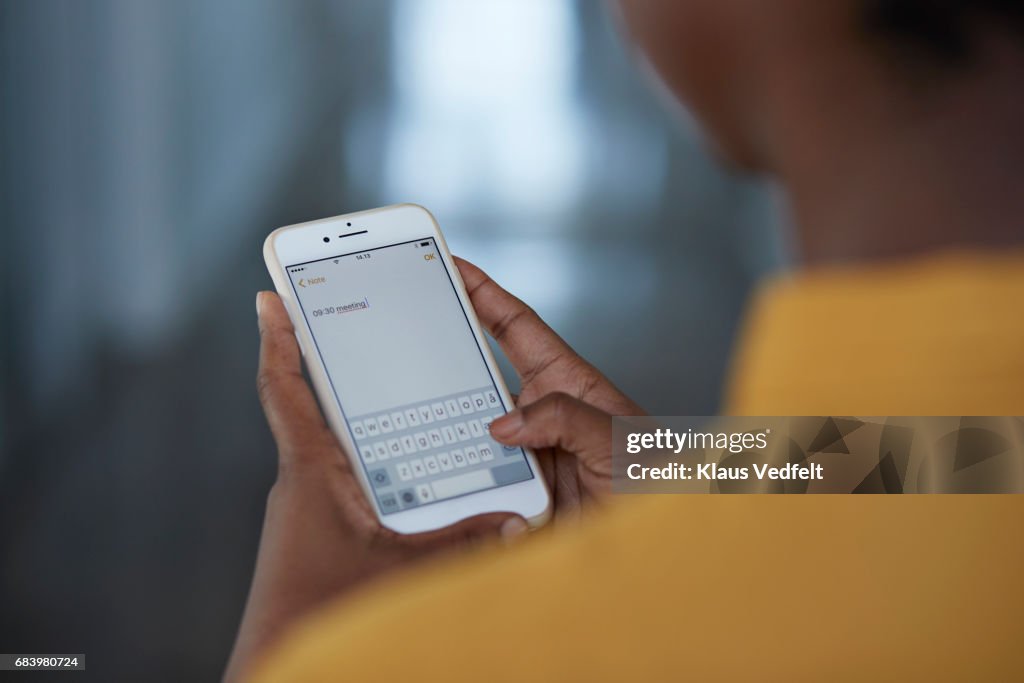 Close-up of businesswomans hands holding phone
