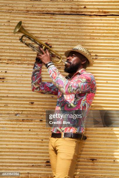 african musician playing trumpet - latin music stock pictures, royalty-free photos & images