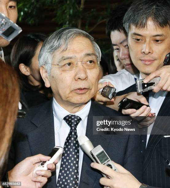 Bank of Japan Governor Haruhiko Kuroda speaks to reporters at the prime minister's office in Tokyo on May 17 after talking with Prime Minister Shinzo...