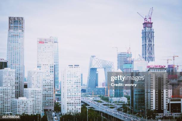 construction sites in beijing guomao - cctv headquarters stock pictures, royalty-free photos & images