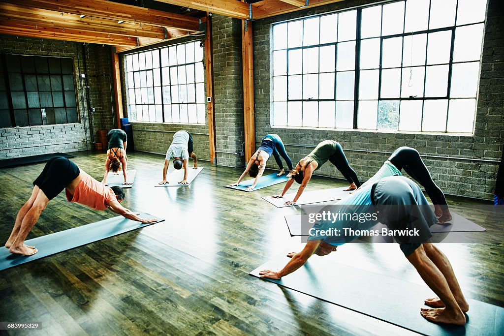 Yoga instructor leading students in class