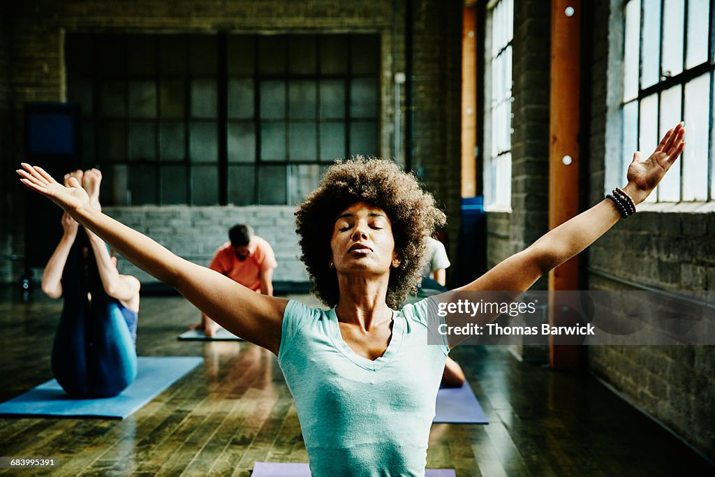 Woman preparing for class in yoga studio