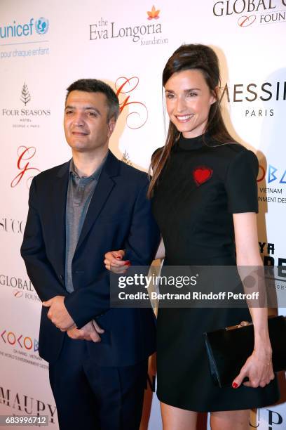 Producer Thomas Langmann and his wife Celine Bosquet attend the "Global Gift, the Eva Foundation" Gala : Photocall at Hotel George V on May 16, 2017...