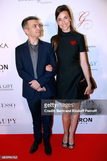 Producer Thomas Langmann and his wife Celine Bosquet attend the "Global Gift, the Eva Foundation" Gala : Photocall at Hotel George V on May 16, 2017...