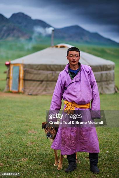 mongolia, nomad man and dog - mongolian culture stock pictures, royalty-free photos & images