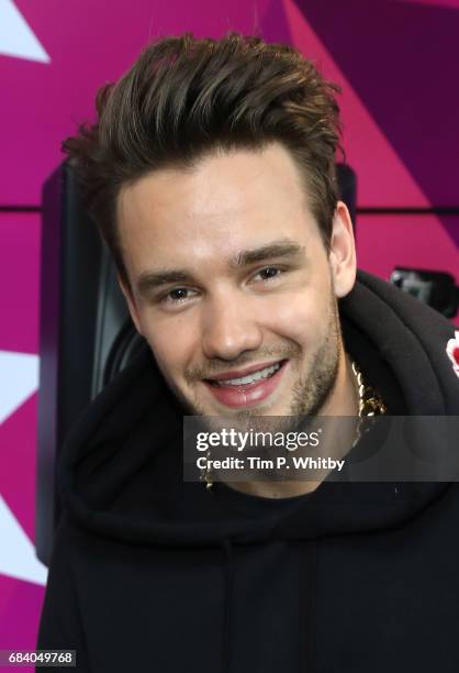 Liam Payne poses for a photo during a visit to Kiss at Golden Sqaure on May 2, 2017 in London, England.