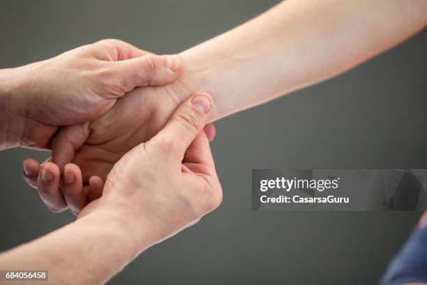 woman having myofascial release therapy to prevent hand tightness - releasing stock pictures, royalty-free photos & images