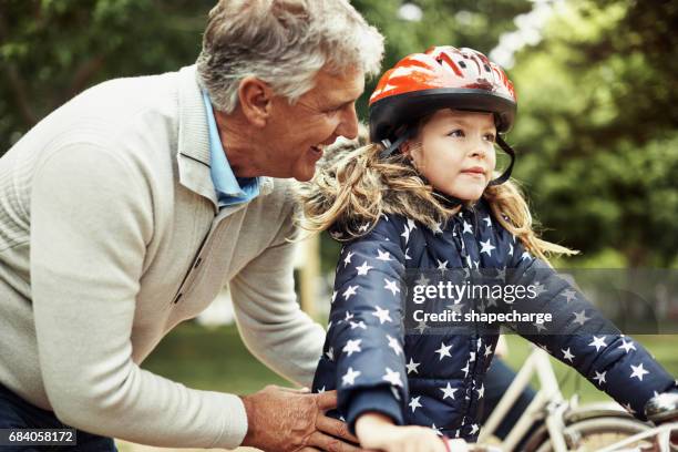 grandpa is her biggest source of support and encouragement - granddaughter stock pictures, royalty-free photos & images