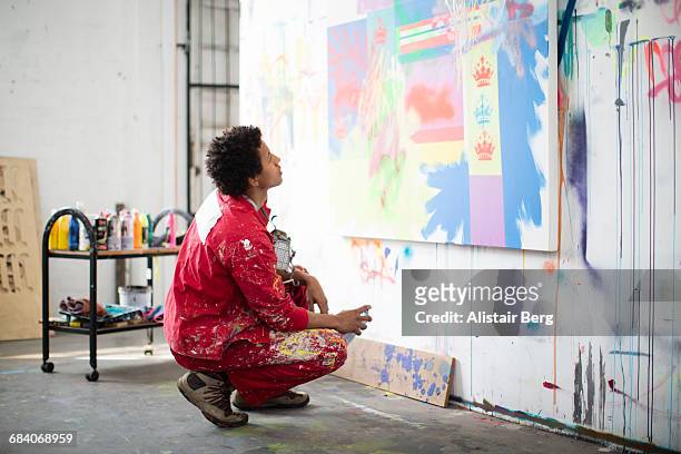 artist working in his studio - graffiti artist stock pictures, royalty-free photos & images