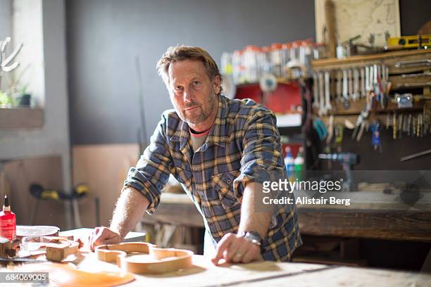 craftsman working in his workshop - 50 54 years stock pictures, royalty-free photos & images
