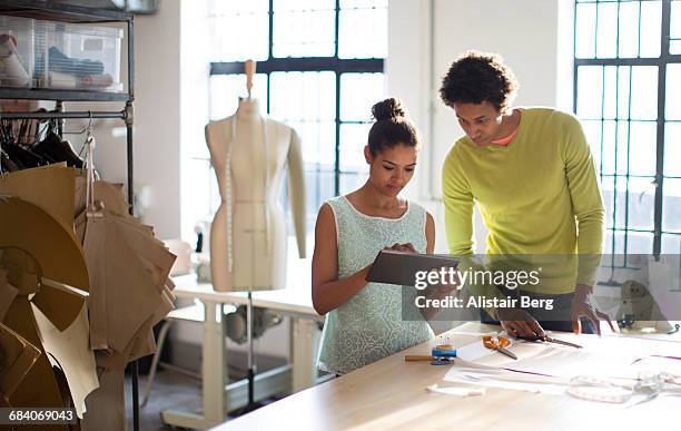 fashion designers working together in their studio - africa craft stock-fotos und bilder