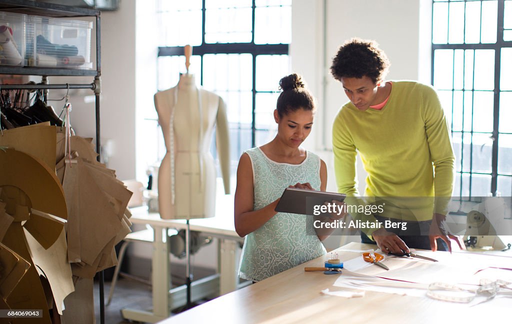 Fashion designers working together in their studio