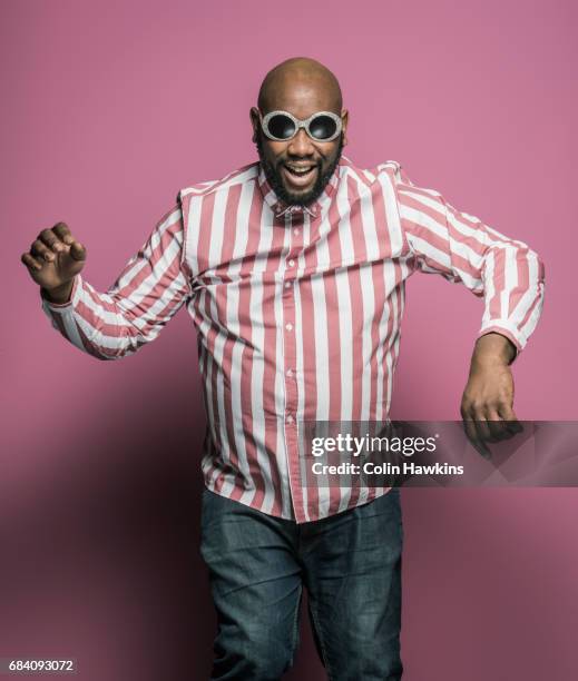 black male dancing - striped shirt stockfoto's en -beelden