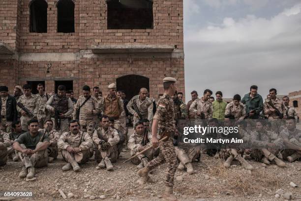 Kurdish peshmerga fighters rest after training in urban guerilla warfare in Erbil, Iraqi Kurdistan.