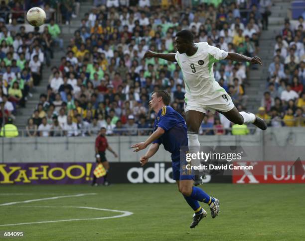 Tobias Linderoth of Sweden and Bartholomew Ogbeche of Nigeria during the first half of the Sweden v Nigeria, Group F, World Cup Group Stage match...