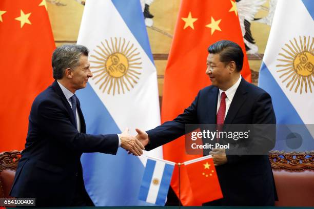 Chinese President Xi Jinping and Argentina's President Mauricio Macri attend a signing ceremony at the Great Hall of the People on May 17, 2017 in...