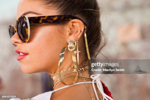 Dancer, Model and Social Influencer Mimi Elashary wearing Pamela Love and Maniamania jewellery and Lucy Folk sunglasses during Mercedes-Benz Fashion...