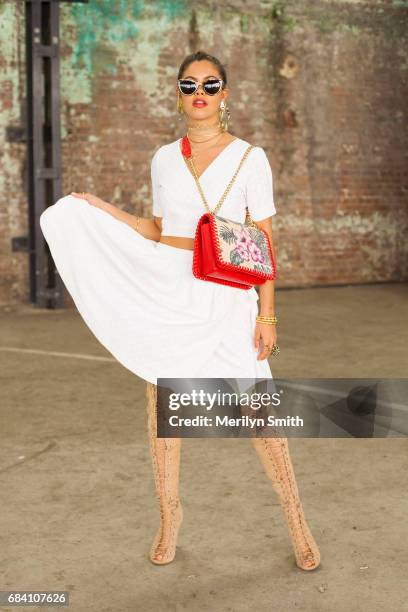Dancer, Model and Social Influencer Mimi Elashary wearing a She made me dress, Hansen and Gretel bag, Tony Bianco shoes, Pamela Love and Maniamania...
