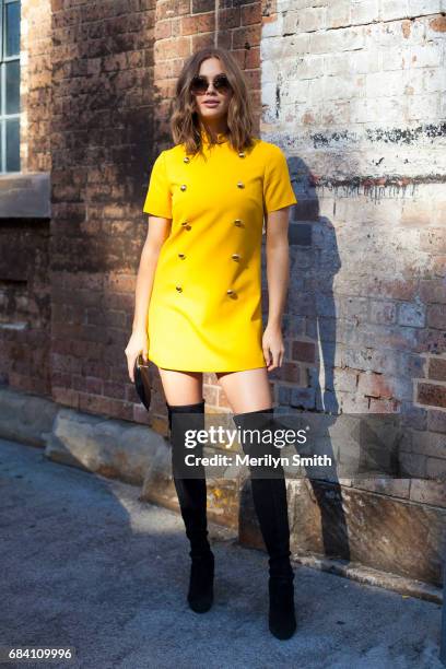 Channel E Presenter Ksenija Lukich wearing a MacGraw dress, Stuart Weitzman boots and Miu Miu sunglasses during Mercedes-Benz Fashion Week Resort 18...