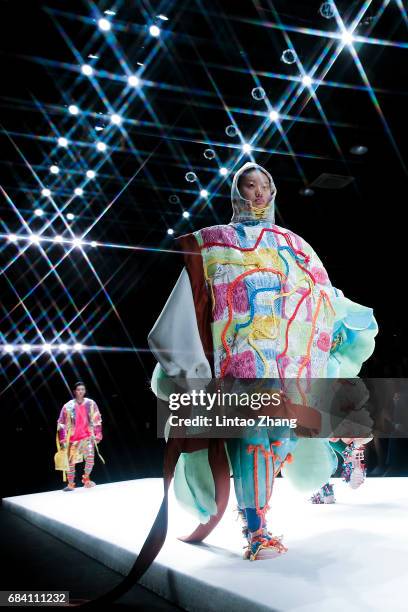 Models showcases designs on the runway at Hubei Institute of Fine Arts Show during the day three of China Graduate Fashion Week at the 751 D.Park...