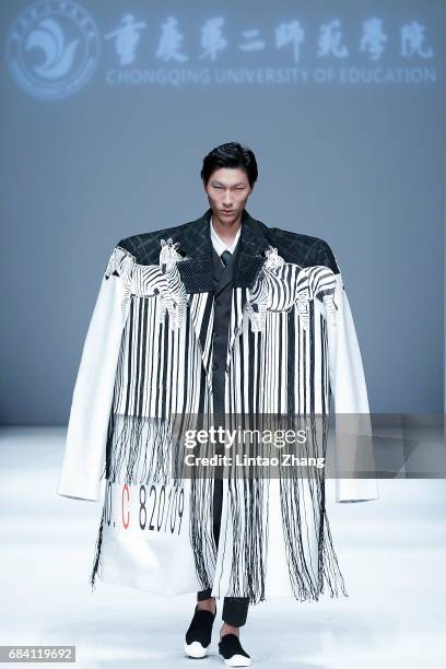 Model showcases designs on the runway at Chongqing University of Education Show during the day three of China Graduate Fashion Week at the 751 D.Park...