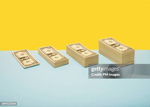stacks of us 1 dollar bills in ascending order - piles of money foto e immagini stock