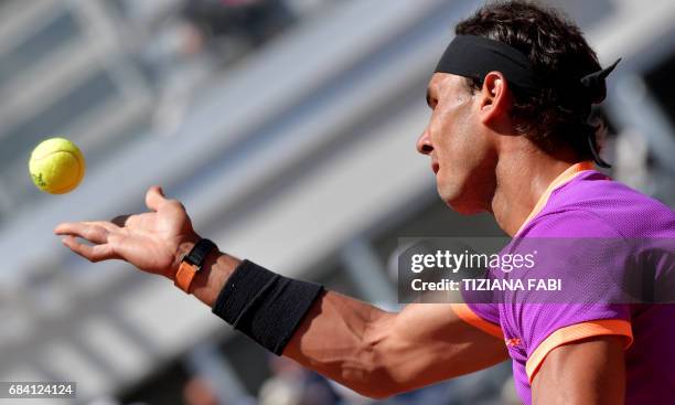 Rafael Nadal of Spain serves against Nicolas Almagro of Spain during their match at the ATP Tennis Open tournament on May 17, 2017 at the Foro...