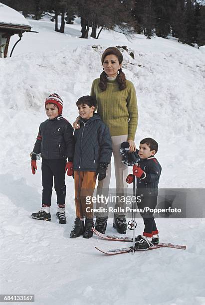 Empress of Iran, Farah Diba pictured with her children Reza Pahlavi, Farahnaz Pahlavi and Ali-Reza Pahlavi during a skiing holiday at St Moritz in...