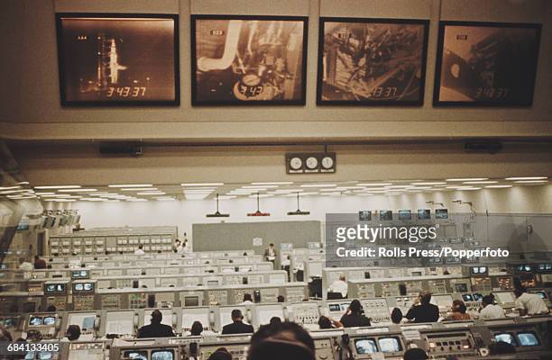 View of NASA technicians preparing for the Apollo 8 rocket launch in the Mission Operation Control Room 2 at the Manned Spacecraft Center in Houston,...