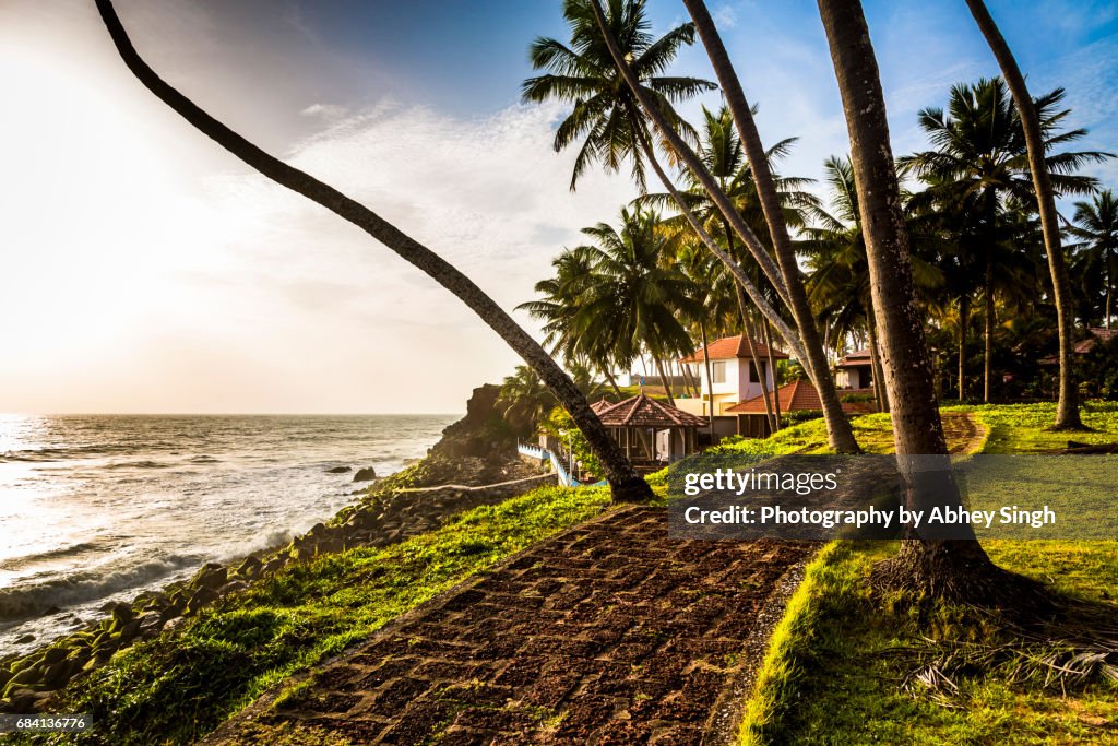 Golden light on a path leading to a resort near Varkala beach, Kerala, India
