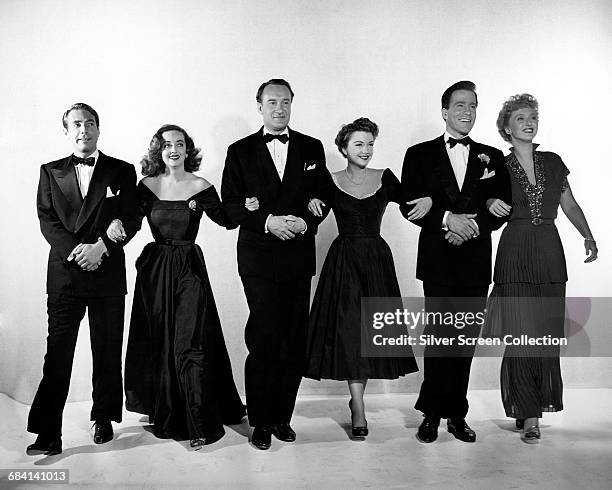 From left to right, Gary Merrill as Bill Simpson, Bette Davis as Margo Channing, George Sanders as Addison DeWitt, Anne Baxter as Eve Harrington,...