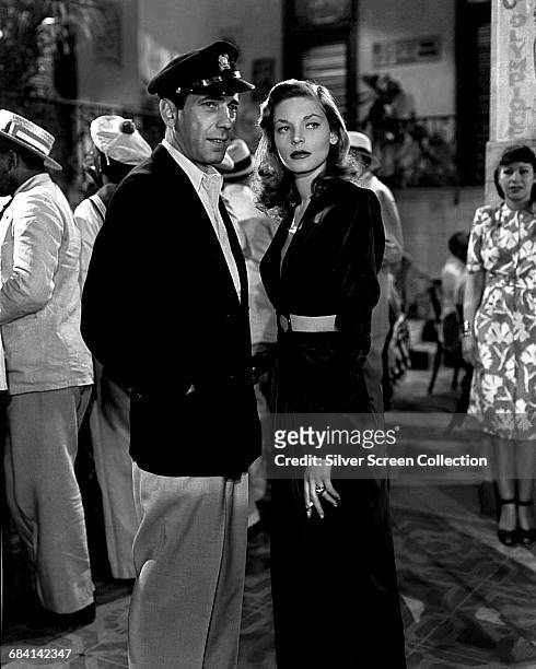 Actors Lauren Bacall as Marie 'Slim' Browning and Humphrey Bogart as Harry Morgan in the film 'To Have and Have Not', 1944.