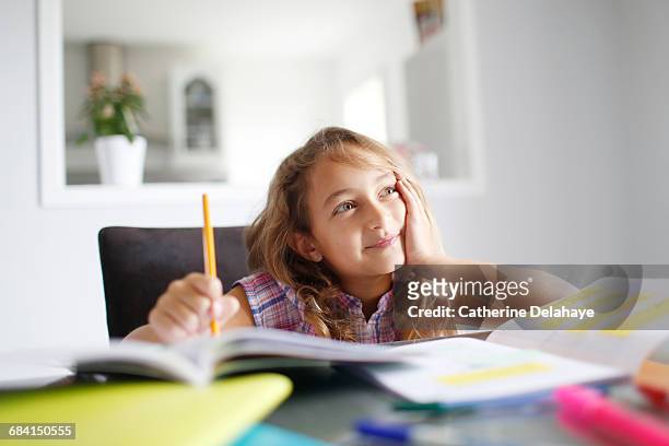 a 7 years old girl doing her homework - 8 9 years stock pictures, royalty-free photos & images