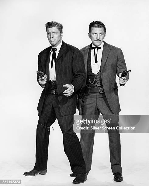 Actors Burt Lancaster and Kirk Douglas in a publicity portrait issued for the film, 'Gunfight at the OK Corral', USA, 1957. The Western, directed by...