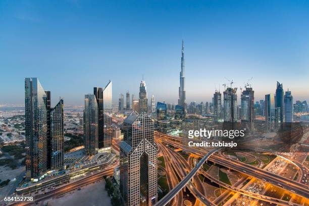dubai skyline - west asia stock pictures, royalty-free photos & images