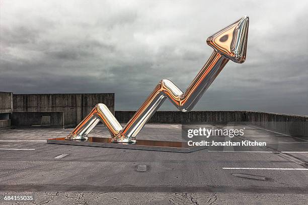 an arrow on a ca rpark floor - arrow sign stock pictures, royalty-free photos & images